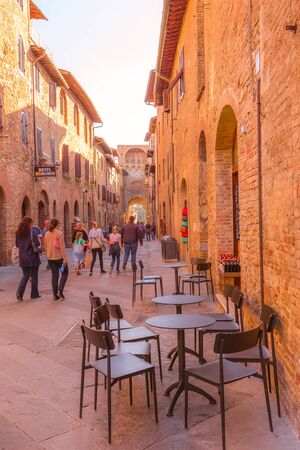 San Gimignano, Tuscany, Italy - October 25, 2018: Old street in typical Tuscan medieval town, popular tourist destinationのeditorial素材