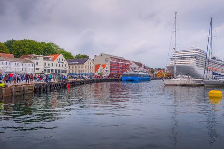 Stavanger, Norway - August 2, 2018: City street view with people, harbour and cruise shipのeditorial素材