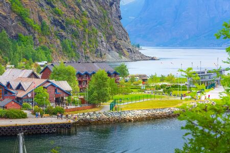 Flam, Norway - July 31, 2018: Norwegian port at Sognefjord fjord and bus stationのeditorial素材