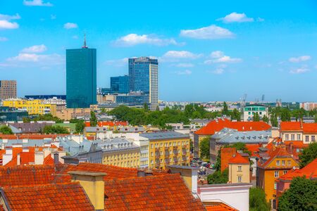 Warsaw, Poland modern skyscrapers and old colorful houses in Old Town of polish capital skyline...