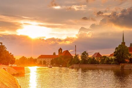 Wroclaw, Poland sunset panoramic view with Ostrow Tumski island, Odra or Oder river and cathedral...