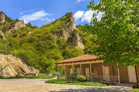 Panoramic view of ancient Shio-Mgvime monastery near Mtskheta, Georgia and cross on top of the hillのeditorial素材