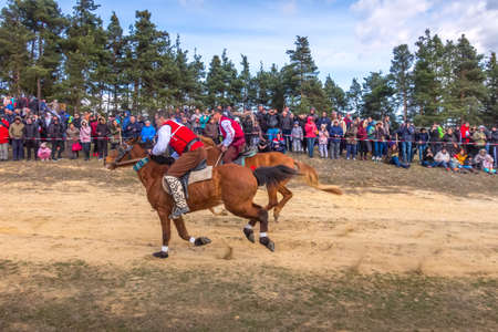 Bachevo, Bulgaria - March 16, 2019: Horse Easter or the day of Todor in Bulgaria, man in traditional bulgarian clothing riding a horseのeditorial素材