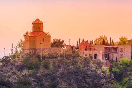 Tbilisi, Georgia Tabor Monastery of the Transformation church on the hill, sunset viewの写真素材