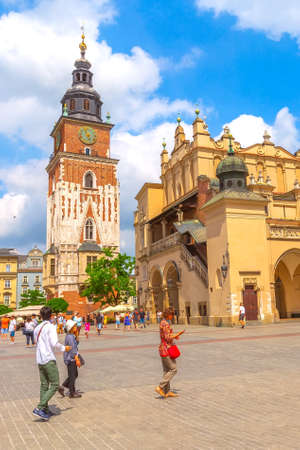 Krakow, Poland - June 18, 2019: The Cloth Hall and Town Hall Tower in the main market square Rynek Glownyのeditorial素材