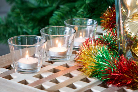 Christmas background with tea candles and gold colored decorationsの写真素材