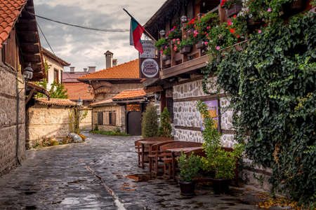 Bansko, Bulgaria - October 31, 2020: Autumn street view in downtown, old traditional bulgarian house, mehanaのeditorial素材