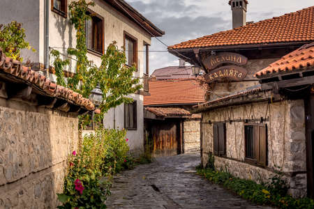 Bansko, Bulgaria - October 31, 2020: Autumn street view in downtown, old traditional bulgarian house, mehanaのeditorial素材