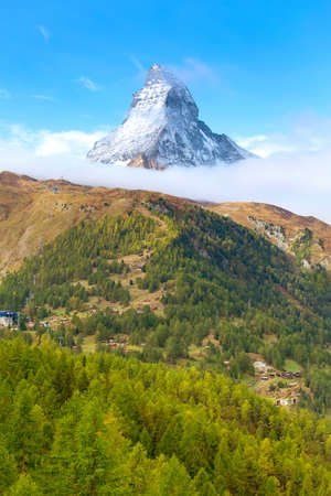 Matterhorn snow mount in Switzerland, Swiss Alps and beautiful alpine village in the pine woodsの写真素材