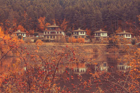 Autumn landscape with lake and houses, Bulgariaの写真素材