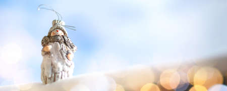 Winter Christmas banner, Snowman toy in the snowの写真素材