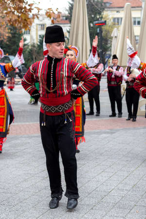 Plovdiv, Bulgaria - November 26, 2021: Young wine parade in the Old Town, traditional folklore dancesのeditorial素材