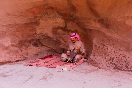 Petra, Jordan Bedouin man playing Rababaのeditorial素材