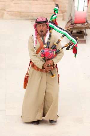 Jerash, Jordan - November 7, 2022: Jordanian bagpipe player in the roman theatre of the archeological siteのeditorial素材