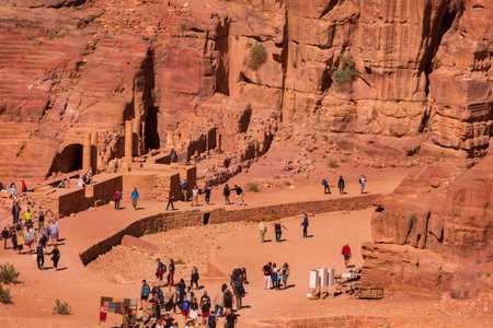 Petra, Jordan - November 3, 2022: View to the ancient Nabataean Royal tombs and main street of Petra full of touristsのeditorial素材