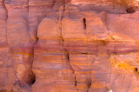 Sandstone rock and mineral layers in Petra, Jordanの写真素材