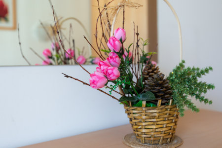 Pink rose flowers on the wooden table and reflection in the mirror, home decor close-upの写真素材