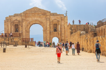 Jerash, Jordan - November 7, 2022: Tourists in front of Arch at the entrance of the archeological siteのeditorial素材