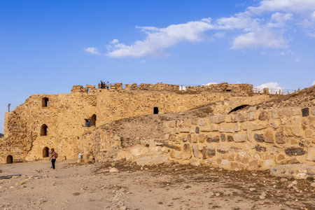 Al Karak, Jordan - November 4, 2022: Medieval Crusaders Castle in the center of the city and touristsのeditorial素材