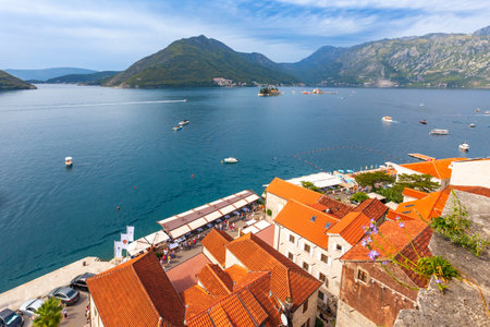 Perast, Montenegro - September 21, 2023: Houses of the ancient town, promenade, sea and boats, high angle panorama viewのeditorial素材