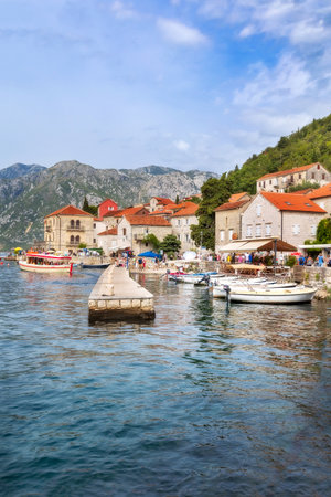 Perast, Montenegro - September 21, 2023: Panorama view of the historic town at famous Bay of Kotor with boats in summerのeditorial素材