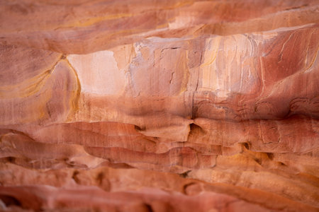 Multi-colored sandstone rock and mineral layers in ancient tombs of Petra, Jordan. Pattern,...