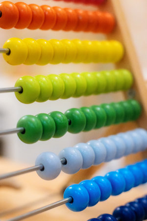 Close-up colorful school abacus bead background for kids, learning count, children math class...