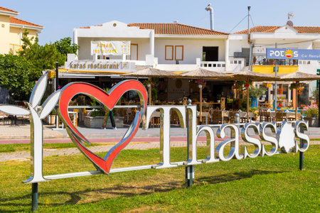 Limenas Port, Thassos, Greece -June 12, 2024: I love Thassos letters in capital and main port of greek islandのeditorial素材