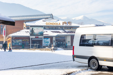 Bansko, Bulgaria - December 20, 2023: Bulgarian winter ski resort, entrance to gondola ski lift station and busesのeditorial素材