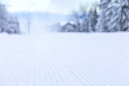 Bansko, Bulgaria bulgarian defocused background of winter ski resort with close-up slope, gondola lift cabins after snowfallの写真素材