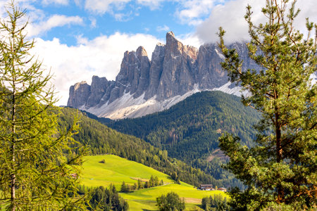 Dolomites, Italy. Aerial panoramic view of St. Magdalena or Santa Maddalena village, Geisler Odle mountains and green alpine meadowsの写真素材