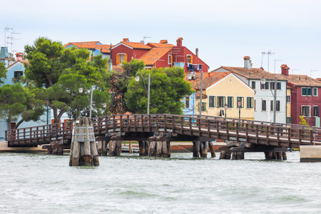 Burano island, Italy colorful houses architecture, view from the sea, street in famous island near Venice. Travel and vacation conceptの写真素材