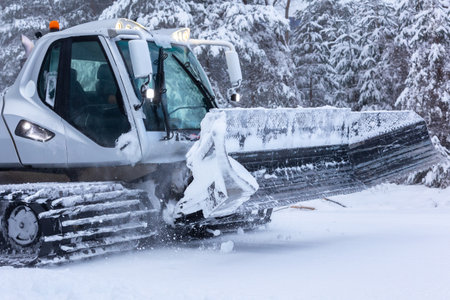 Bansko, Bulgaria snow groomer snowcat ratrack machine preparing ski slope close-upの写真素材