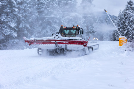 Bansko, Bulgaria winter ski resort with red ratrack on the slope, gondola lift cabinsの写真素材