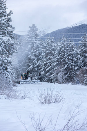 Bansko, Bulgaria snow groomer snowcat ratrack machine preparing ski slope after snowfallの写真素材