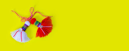 Bulgarian symbol of spring white and red martenitsa on yellow banner background