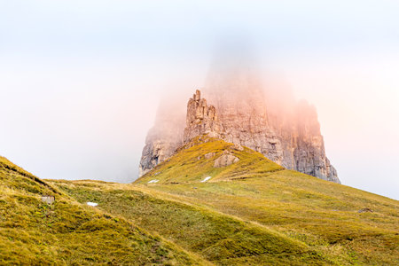 Beautiful summer foggy landscape in Dolomites Mountains, Gardena Pass, Trentino, South Tyrol, Italy