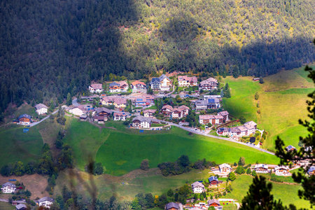 Alpe di Siusi, Italy aerial panoramic view with wooden cottages at Seiser Alm, Dolomite plateau in South Tyrol province in autumnの写真素材