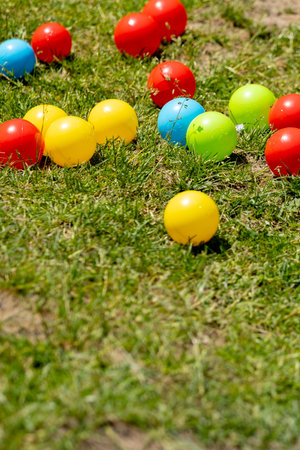 Multi colored balls on the green grassの写真素材