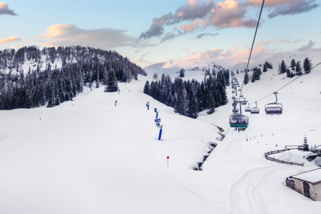 Ski chair lift and slope view in austrian resort Saalbach Hinterglemm, Austriaの写真素材