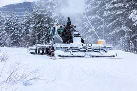 Bansko, Bulgaria snow groomer snowcat ratrack machine preparing ski slope after snowfallの写真素材