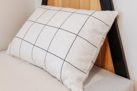 Comfortable soft white pillow on the bed, guest accommodation readyの写真素材