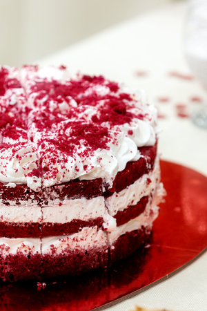 Red velvet layered cake with cream frosting