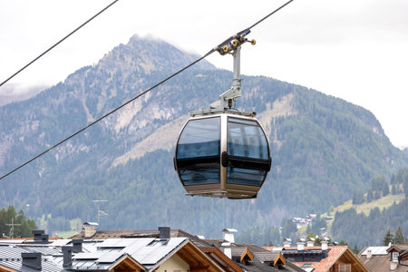 Cable car cabin, summer view of Canazei, Italy village in Fassa valley in Trentino Alto Adige