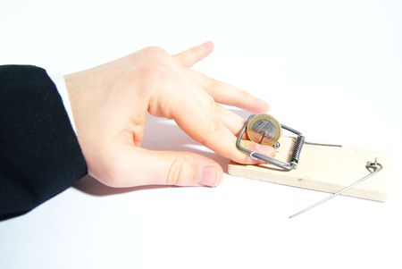  	Human hand in mousetrap with euro