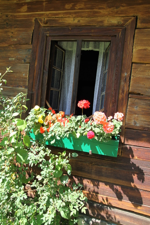 Window from wooden cottageの写真素材