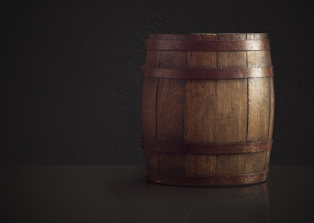 Old wooden barrel on a brown backgroundの写真素材