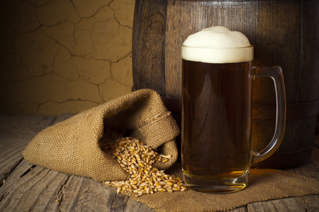 Still Life with a keg of beer and draft beer by the glass.の写真素材