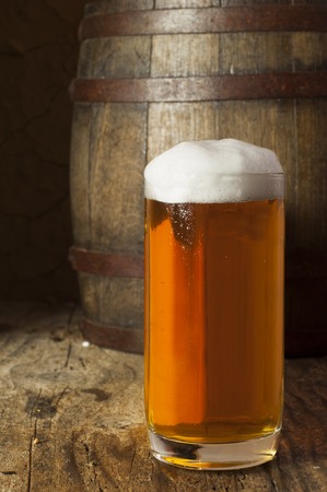 Still Life with a keg of beer and draft beer by the glass.の写真素材