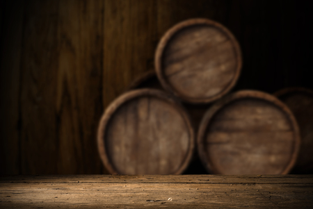 background of barrel and worn old table of wood,の写真素材